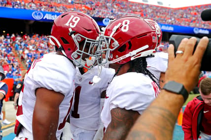 Sep 18, 2021; Gainesville, Florida, USA; Alabama Crimson Tide tight end Jahleel Billingsley (19) celebrates with wide receiver John Metchie III (8) after scoring a touchdown during the first quarter against the Florida Gators celebrates at Ben Hill Griffin Stadium. Mandatory Credit: Mark J. Rebilas-USA TODAY Sports