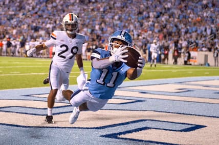 Sep 18, 2021; Chapel Hill, North Carolina, USA; North Carolina Tar Heels wide receiver Josh Downs (11) catches a touchdown in the end zone as Virginia Cavaliers free safety Joey Blount (29) defends in the first quarter at Kenan Memorial Stadium. Mandatory Credit: Bob Donnan-USA TODAY Sports