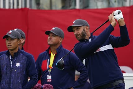 Sep 21, 2021; Kohler, Wisconsin, USA; Dustin Johnson watches his tee shot on the 1st hole during practice rounds for the 43rd Ryder Cup golf competition at Whistling Straits. Mandatory Credit: Michael Madrid-USA TODAY Sports