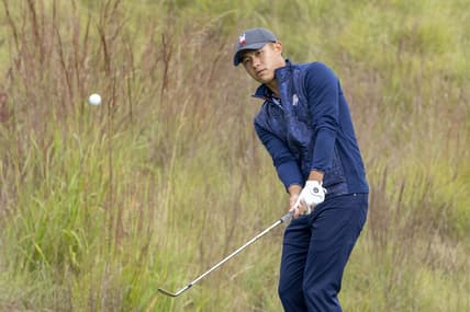 September 21, 2021; Kohler, Wisconsin, USA; U.S. Team player Collin Morikawa hits a chip shot on the practice area during a practice round for the 43rd Ryder Cup golf competition at Whistling Straits. Mandatory Credit: Kyle Terada-USA TODAY Sports