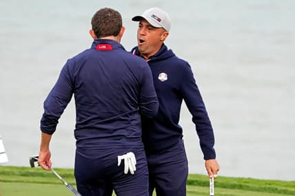 Sep 24, 2021; Haven, Wisconsin, USA; Team USA player Justin Thomas reacts with Team USA player Patrick Cantlay after making his putt on the 16th green during day one foursome matches for the 43rd Ryder Cup golf competition at Whistling Straits. Mandatory Credit: Kyle Terada-USA TODAY Sports