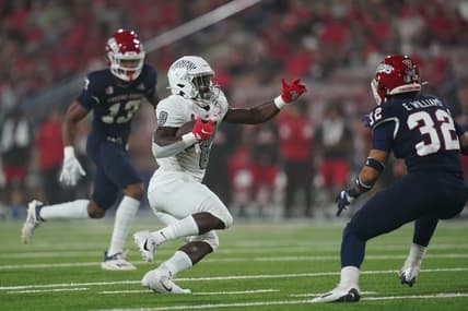 Sep 24, 2021; Fresno, California, USA; UNLV Rebels outside linebacker Kylan Wilborn (8) runs the ball against the Fresno State Bulldogs in the first quarter at Bulldog Stadium. Mandatory Credit: Cary Edmondson-USA TODAY Sports
