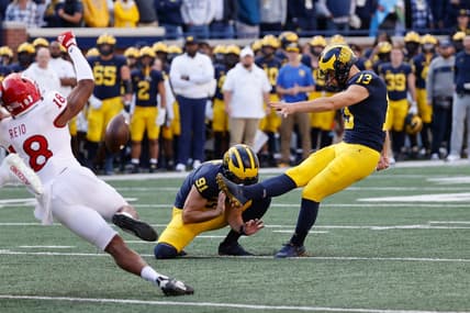 Sep 25, 2021; Ann Arbor, Michigan, USA;  Michigan Wolverines place kicker Jake Moody (13) kicks a field goal out of the hold by Michigan Wolverines punter Brad Robbins (91) in first half against the Rutgers Scarlet Knights at Michigan Stadium. Mandatory Credit: Rick Osentoski-USA TODAY Sports