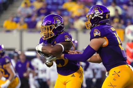 Sep 25, 2021; Greenville, North Carolina, USA; East Carolina Pirates running back Keaton Mitchell (25) scores a first-half touchdown against the Charleston Southern Buccaneers at Dowdy-Ficklen Stadium. Mandatory Credit: James Guillory-USA TODAY Sports