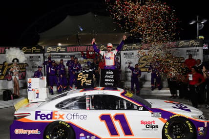 Sep 26, 2021; Las Vegas, Nevada, USA; NASCAR Cup Series driver Denny Hamlin (11) celebrates his victory of  the South Point 400 at Las Vegas Motor Speedway. Mandatory Credit: Gary A. Vasquez-USA TODAY Sports