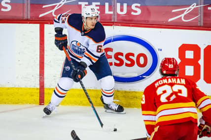 Mar 15, 2021; Calgary, Alberta, CAN; Edmonton Oilers left wing Tyler Ennis (63) controls the puck against the Calgary Flames during the second period at Scotiabank Saddledome. Mandatory Credit: Sergei Belski-USA TODAY Sports