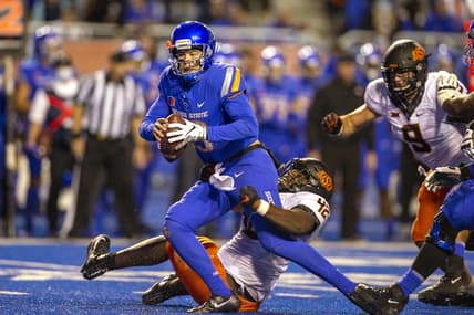 Sep 18, 2021; Boise, Idaho, USA; Boise State Broncos quarterback Hank Bachmeier (19) is sacked by Oklahoma State Cowboys defensive tackle Jayden Jernigan (42) during the second half at Albertsons Stadium. Oklahoma State won 21-20. Mandatory Credit: Brian Losness-USA TODAY Sports