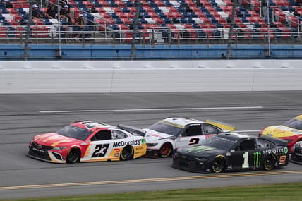 Oct 4, 2021; Talladega, Alabama, USA; NASCAR Cup Series driver Bubba Wallace (23) leads a pack of cars during the YellaWood 500 at Talladega Superspeedway. Mandatory Credit: Adam Hagy-USA TODAY Sports