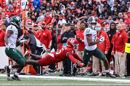 Oct 9, 2021; Piscataway, New Jersey, USA; Michigan State Spartans wide receiver Tre Mosley (17) is tackled by Rutgers Scarlet Knights defensive back Kessawn Abraham (5) during the first half at SHI Stadium. Mandatory Credit: Vincent Carchietta-USA TODAY Sports