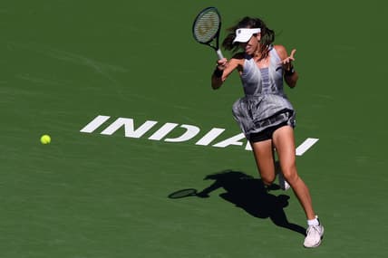 Oct 9, 2021; Indian Wells, CA, USA; Ajla Tomljanovic (AUS) hits a shot against Garbine Muguruza (ESP) at Indian Wells Tennis Garden. Mandatory Credit: Orlando Ramirez-USA TODAY Sports