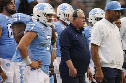 Oct 9, 2021; Chapel Hill, North Carolina, USA;  North Carolina Tar Heels head coach  Mack Brown looks on from with quarterback Sam Howell (7) the sidelines against the Florida State Seminoles at Kenan Memorial Stadium. Mandatory Credit: James Guillory-USA TODAY Sports