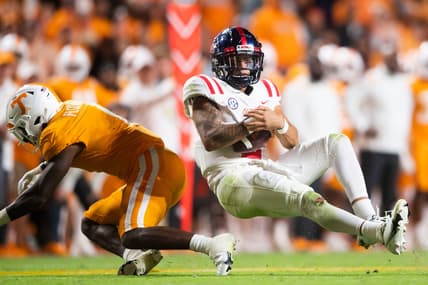 Mississippi quarterback Matt Corral (2) is knocked over by Tennessee defensive back Trevon Flowers (1) during an SEC football game between Tennessee and Ole Miss at Neyland Stadium in Knoxville, Tenn. on Saturday, Oct. 16, 2021.

Kns Tennessee Ole Miss Football