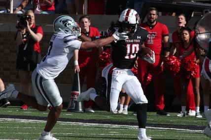 Oct 23, 2021; Lubbock, Texas, USA;  Texas Tech Red Raiders kick returner Kaylon Geiger Sr. (10) returns a kick against Kansas State Wildcats defensive back TJ Smith (7) in the first half at Jones AT&T Stadium. Mandatory Credit: Michael C. Johnson-USA TODAY Sports