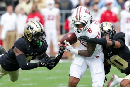 Purdue cornerback Dedrick Mackey (1) and Purdue safety Cam Allen (10) stop Wisconsin running back Chez Mellusi (6) during the first quarter of an NCAA college football game, Saturday, Oct. 23, 2021 at Ross-Ade Stadium in West Lafayette.

Cfb Purdue Vs Wisconsin