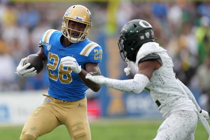 Oct 23, 2021; Pasadena, California, USA; UCLA Bruins running back Brittain Brown (28) carries the ball against the Oregon Ducks in the first half at Rose Bowl. Mandatory Credit: Kirby Lee-USA TODAY Sports