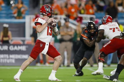 Oct 23, 2021; Miami Gardens, Florida, USA; North Carolina State Wolfpack quarterback Devin Leary (13) prepares to throws a pass against the Miami Hurricanes during the first quarter of the game at Hard Rock Stadium. Mandatory Credit: Sam Navarro-USA TODAY Sports