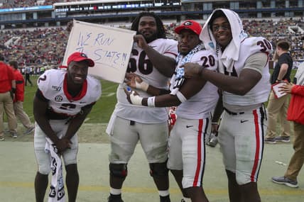 Nov 30, 2019; Atlanta, GA, USA; Georgia Bulldogs defensive back Richard LeCounte (2) and offensive lineman Solomon Kindley (66) and defensive back J.R. Reed (20) and linebacker Tae Crowder (30) celebrate against the Georgia Tech Yellow Jackets in the second half at Bobby Dodd Stadium. Mandatory Credit: Brett Davis-USA TODAY Sports