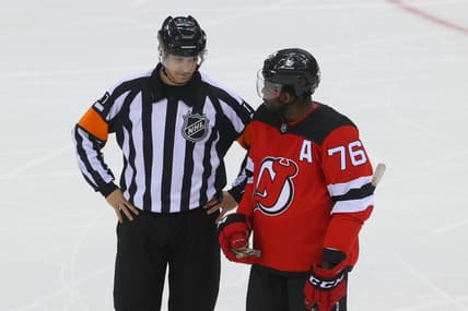 Apr 9, 2021; Newark, New Jersey, USA; referee Frederick L'Ecuyer (17) and New Jersey Devils defenseman P.K. Subban (76) talk during the first period at Prudential Center. Mandatory Credit: Ed Mulholland-USA TODAY Sports