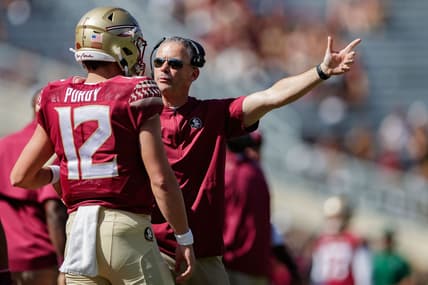 Florida State Seminoles head coach Mike Norvell talks to Florida State Seminoles quarterback Chubba Purdy (12) after coming off the field. The Florida State Seminoles defeated the Massachusetts Minutemen 59-3 at Doak Campbell Stadium on Saturday, Oct. 23, 2021.

Fsu V Umass Second Half337