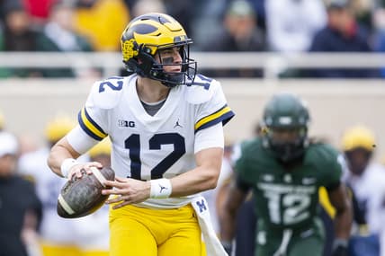 Oct 30, 2021; East Lansing, Michigan, USA; Michigan Wolverines quarterback Cade McNamara (12) looks to pass the ball during the first quarter against the Michigan State Spartans at Spartan Stadium. Mandatory Credit: Raj Mehta-USA TODAY Sports