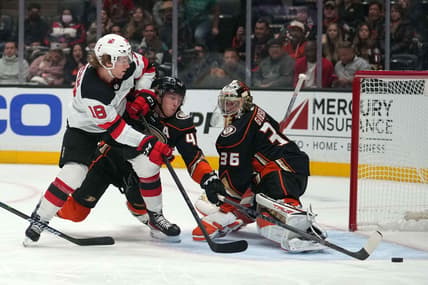 Nov 2, 2021; Anaheim, California, USA; Anaheim Ducks defenseman Cam Fowler (4) and goaltender John Gibson (36) defend the goal against New Jersey Devils center Dawson Mercer (18) in the first period at Honda Center. Mandatory Credit: Kirby Lee-USA TODAY Sports