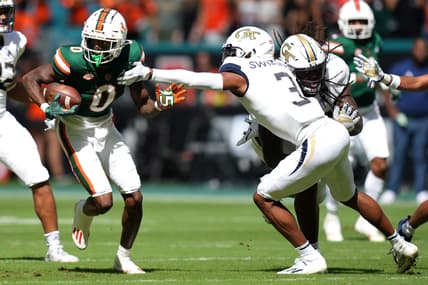 Nov 6, 2021; Miami Gardens, Florida, USA; Georgia Tech Yellow Jackets defensive back Tre Swilling (3) reaches for Miami Hurricanes wide receiver Romello Brinson (0) during the first half at Hard Rock Stadium. Mandatory Credit: Jasen Vinlove-USA TODAY Sports