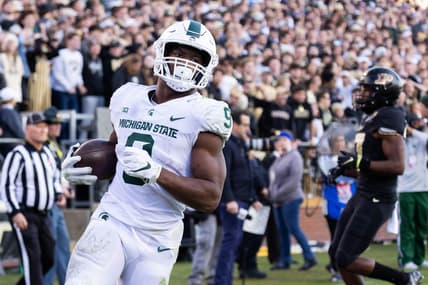 Nov 6, 2021; West Lafayette, Indiana, USA; Michigan State Spartans running back Kenneth Walker III (9) runs for a touchdown in the first half against the Purdue Boilermakers at Ross-Ade Stadium. Mandatory Credit: Trevor Ruszkowski-USA TODAY Sports