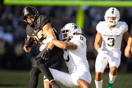 Nov 6, 2021; West Lafayette, Indiana, USA; Purdue Boilermakers wide receiver Jackson Anthrop (33) runs the ball while Michigan State Spartans linebacker Quavaris Crouch (6) defends in the first half at Ross-Ade Stadium. Mandatory Credit: Trevor Ruszkowski-USA TODAY Sports