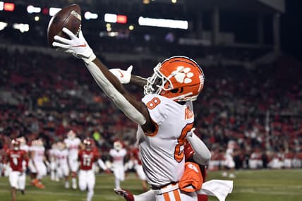 Nov 6, 2021; Louisville, Kentucky, USA;  Clemson Tigers wide receiver Justyn Ross (8)  stretches to catch an over thrown pass against the Louisville Cardinals during the second half at Cardinal Stadium. Clemson defeated Louisville 30-24. Mandatory Credit: Jamie Rhodes-USA TODAY Sports