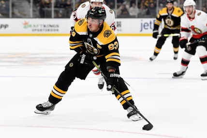 Nov 9, 2021; Boston, Massachusetts, USA; Boston Bruins center Brad Marchand (63) skates with the puck against the Ottawa Senators during the first period at the TD Garden. Mandatory Credit: Brian Fluharty-USA TODAY Sports