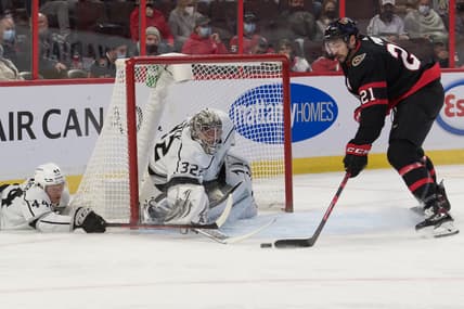Nov 11, 2021; Ottawa, Ontario, CAN; Ottawa Senators left wing Nick Paul (21) steals the puck away from Los Angeles Kings goalie Jonathan Quick (32) as defenseman Mikey Anderson (44) defends in the second period at the Canadian Tire Centre. Mandatory Credit: Marc DesRosiers-USA TODAY Sports