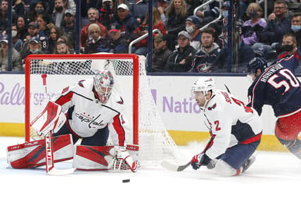 Nov 12, 2021; Columbus, Ohio, USA; Washington Capitals goalie Ilya Samsonov (30) tracks the rebound of a Columbus Blue Jackets left wing Eric Robinson (50) shot during the first period at Nationwide Arena. Mandatory Credit: Russell LaBounty-USA TODAY Sports