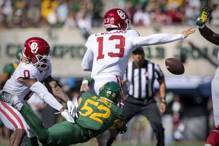 Nov 13, 2021; Waco, Texas, USA; Baylor Bears linebacker Matt Jones (52) knocks the ball away from Oklahoma Sooners quarterback Caleb Williams (13) during the second half at McLane Stadium. Mandatory Credit: Jerome Miron-USA TODAY Sports
