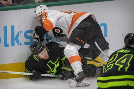 Nov 13, 2021; Dallas, Texas, USA; Philadelphia Flyers defenseman Justin Braun (61) checks Dallas Stars center Joe Pavelski (16) during the first period at the American Airlines Center. Mandatory Credit: Jerome Miron-USA TODAY Sports