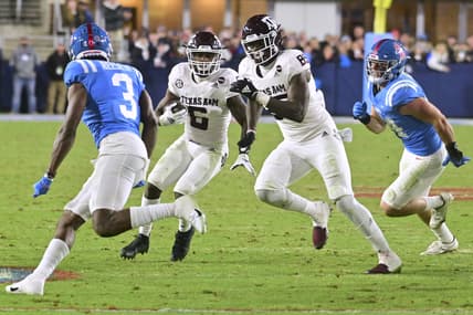 Nov 13, 2021; Oxford, Mississippi, USA; Texas A&M Aggies running back Devon Achane (6) runs the ball against Mississippi Rebels defensive back Otis Reese (3) during the third quarter at Vaught-Hemingway Stadium. Mandatory Credit: Matt Bush-USA TODAY Sports