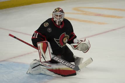 Nov 14, 2021; Ottawa, Ontario, CAN; Ottawa Senators goalie Anton Forsberg (31) makes a save in the third period against the Calgary Flames at the Canadian Tire Centre. Mandatory Credit: Marc DesRosiers-USA TODAY Sports