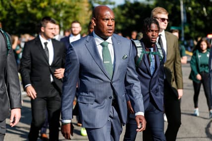 Michigan State head coach Mel Tucker and players march towards Spartan Stadium before the Youngstown State game in East Lansing on Saturday, Sept. 11, 2021. Michigan State won the game, 42-14.