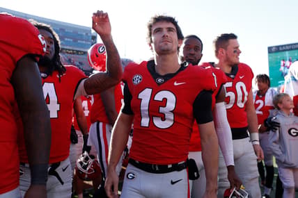 Georgia quarterback Stetson Bennett (13) looks up at fans after a NCAA college football game between Charleston Southern and Georgia in Athens, Ga., on Saturday, Nov. 20, 2021. Georgia won 56-7.

News Joshua L Jones