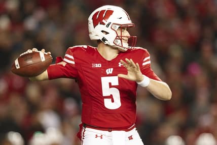 Nov 20, 2021; Madison, Wisconsin, USA;  Wisconsin Badgers quarterback Graham Mertz (5) throws a pass during the third quarter against the Nebraska Cornhuskers at Camp Randall Stadium. Mandatory Credit: Jeff Hanisch-USA TODAY Sports