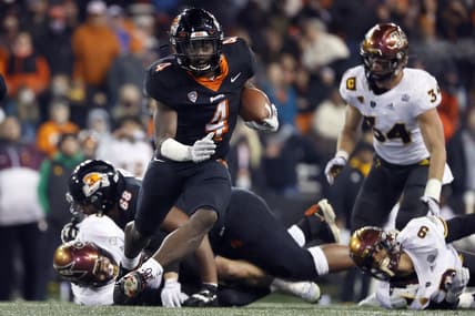 Nov 20, 2021; Corvallis, Oregon, USA; Oregon State Beavers running back B.J. Baylor (4) runs with the ball against the Arizona State Sun Devils during the second half at Reser Stadium. Mandatory Credit: Soobum Im-USA TODAY Sports