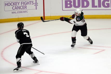 Nov 21, 2021; Los Angeles, California, USA; Arizona Coyotes defenseman Kyle Capobianco (75) shoots the game winning shot in the overtime against the Los Angeles King at Staples Center. The Coyotes wins 2-1. Mandatory Credit: Kiyoshi Mio-USA TODAY Sports