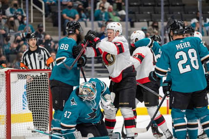 Nov 24, 2021; San Jose, California, USA;  San Jose Sharks defenseman Brent Burns (88) and Ottawa Senators left wing Brady Tkachuk (7) fight in front of the net during the first period at SAP Center at San Jose. Mandatory Credit: Neville E. Guard-USA TODAY Sports