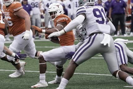 Nov 26, 2021; Austin, Texas, USA; Texas Longhorns running back Roschon Johnson (2) runs for yardage during the first half against the Kansas State Wildcats at Darrell K Royal-Texas Memorial Stadium. Mandatory Credit: Scott Wachter-USA TODAY Sports