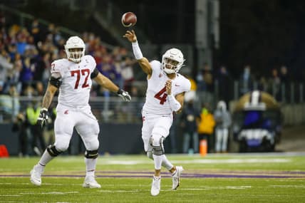 Nov 26, 2021; Seattle, Washington, USA; Washington State Cougars quarterback Jayden de Laura (4) passes against the Washington Huskies during the second quarter at Alaska Airlines Field at Husky Stadium. Mandatory Credit: Joe Nicholson-USA TODAY Sports