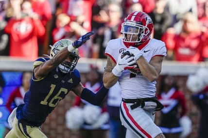 Nov 27, 2021; Atlanta, Georgia, USA; Georgia Bulldogs wide receiver Jermaine Burton (7) catches a touchdown pass behind Georgia Tech Yellow Jackets defensive back Myles Sims (16) during the first quarter at Bobby Dodd Stadium. Mandatory Credit: Dale Zanine-USA TODAY Sports