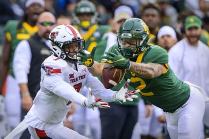 Nov 27, 2021; Waco, Texas, USA; Texas Tech Red Raiders quarterback Donovan Smith (7) and Baylor Bears linebacker Terrel Bernard (2) dive for the ball on a muffed punt by Smith during the first half at McLane Stadium. Mandatory Credit: Jerome Miron-USA TODAY Sports