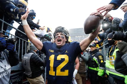 Nov 27, 2021; Ann Arbor, MI, USA; Michigan quarterback Cade McNamara celebrates with fans as he walks up the tunnel after Michigan's 42-27 win over Ohio State on Saturday, Nov. 27, 2021, at Michigan Stadium. Mandatory Credit: Junfu Han-USA TODAY Sports