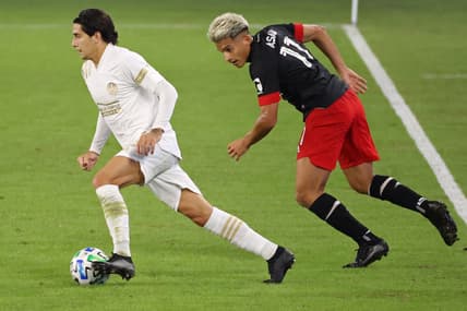 Oct 3, 2020; Washington, DC, Washington, DC, USA; Atlanta United FC defender Franco Escobar (2) dribbles the ball past D.C. United midfielder Yamil Asad (11) in the first half at Audi Field. Mandatory Credit: Geoff Burke-USA TODAY Sports