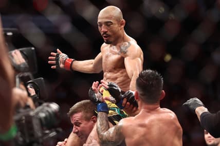 Aug 7, 2021; Houston, Texas, USA; Jose Aldo (red gloves) reacts to fight against Pedro Munhoz (blue gloves) during UFC 265 at Toyota Center. Mandatory Credit: Troy Taormina-USA TODAY Sports