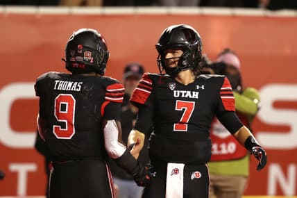 Oct 30, 2021; Salt Lake City, Utah, USA;  Utah Utes running back Tavion Thomas (9) celebrates his touchdown with quarterback Cameron Rising (7) during the fourth quarter against the UCLA Bruins at Rice-Eccles Stadium. Mandatory Credit: Rob Gray-USA TODAY Sports